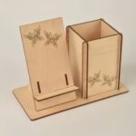 Laser Cut Phone And Pen Stand Free Vector