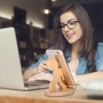 Laser Cut Creative Wooden Character Cell Phone Stand Free Vector