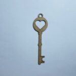 Laser Cut Key Shape With Heart Cutout Free Vector